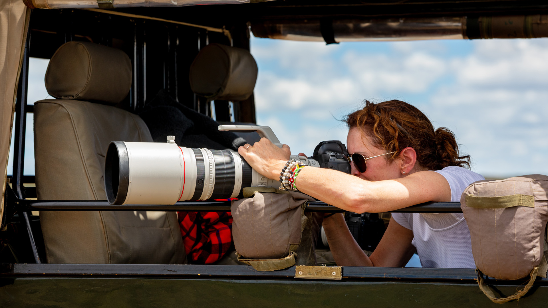 Guest photographing wildlife on safari